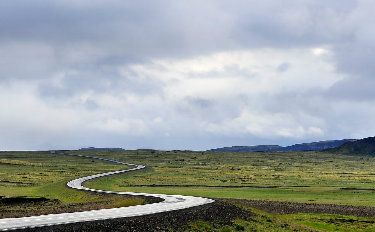Wet asphalt road after seasonal rain, relevant to tire traction